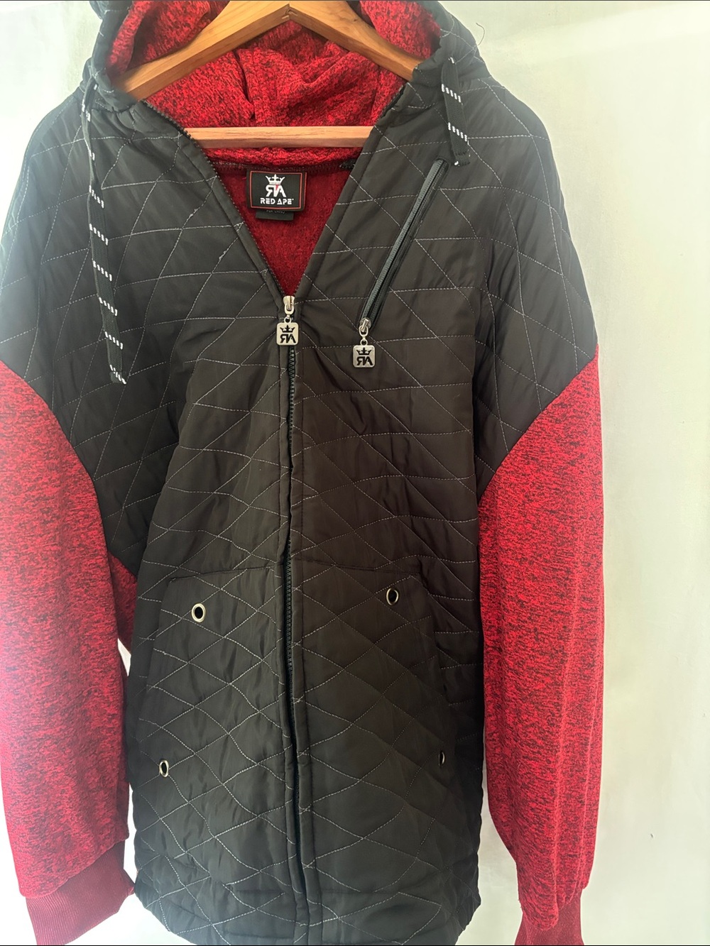 Red App Quilted Black Puffer Jacket with Red Sleeves and Hood. Discontinued.